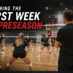 Volleyball coach observing players during an early preseason practice