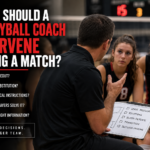 Volleyball coach talking with players during a timeout while considering substitutions, tactical instructions, and player-led problem solving.